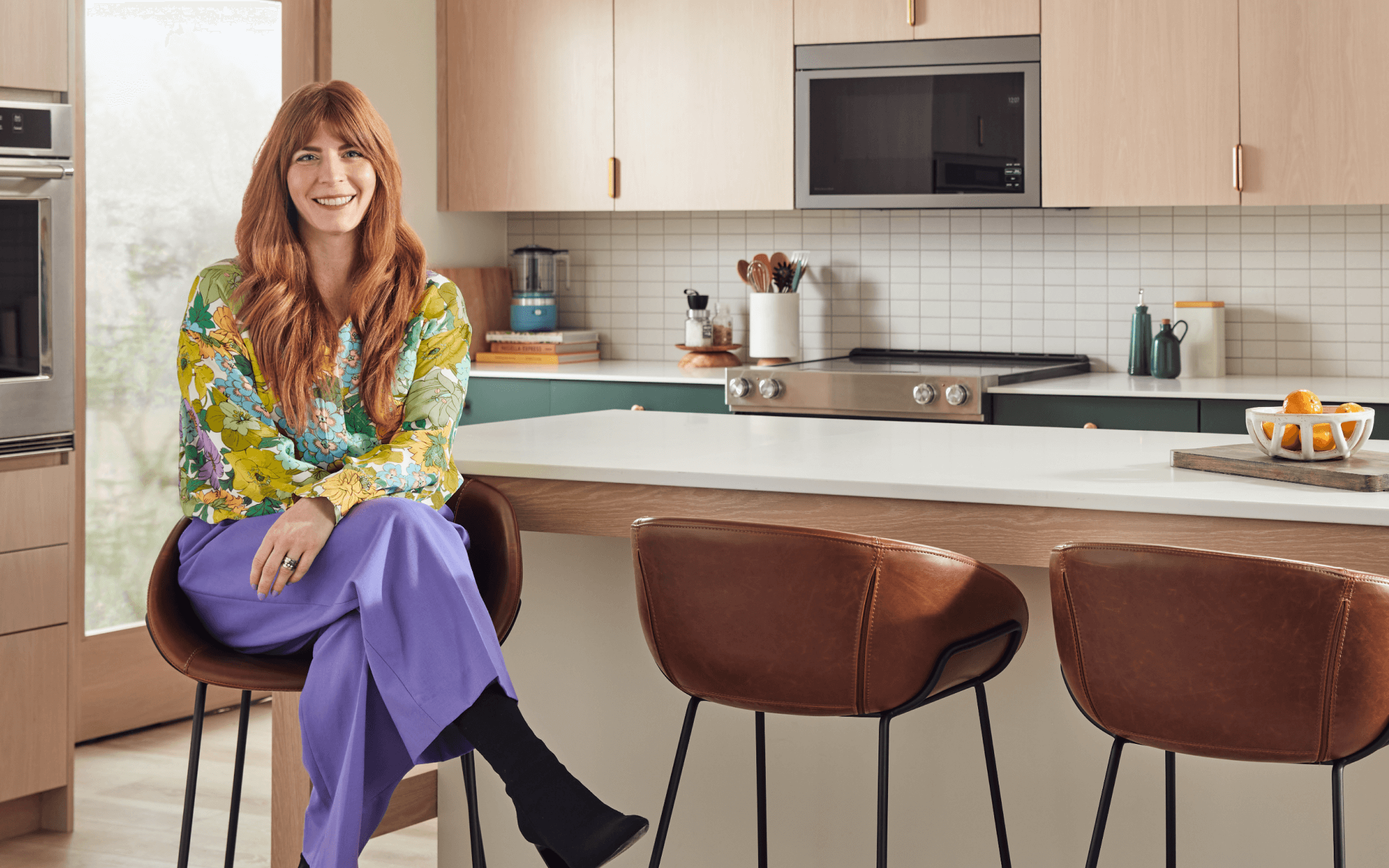 Brittni Pertijs in a sleek, modern kitchen.