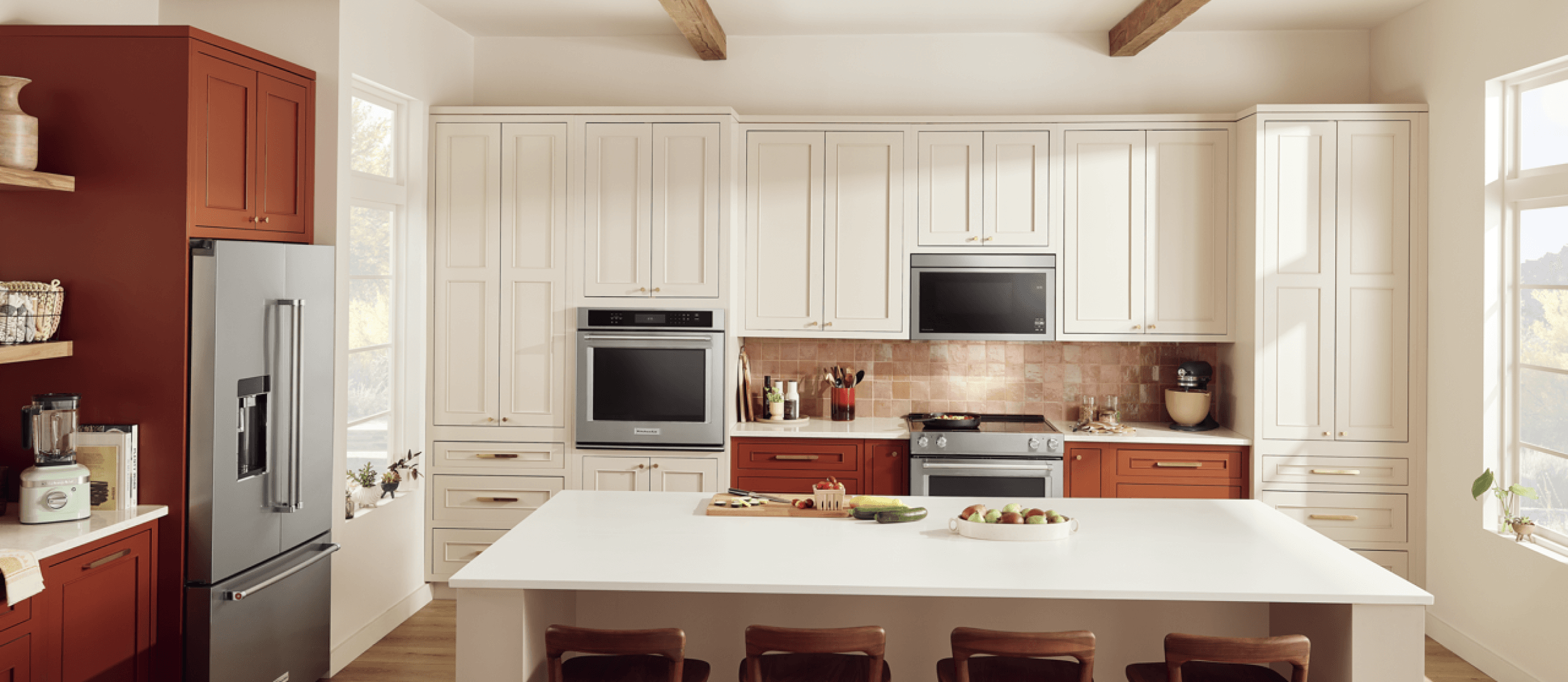 A southwest kitchen with warm cabinetry, stainless steel KitchenAid® appliances and natural textures throughout.