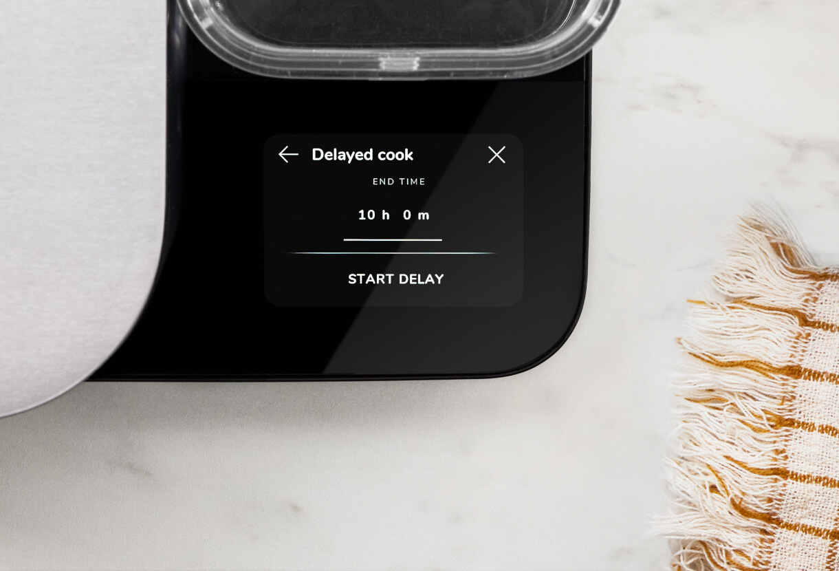 A close up of the controls of the grain and rice cooker, showing the delayed cook mode.