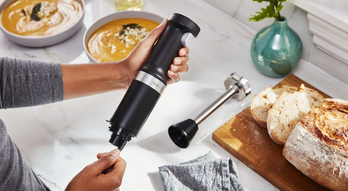 Same as Image Alt Text Person taking apart black KitchenAid® immersion blender