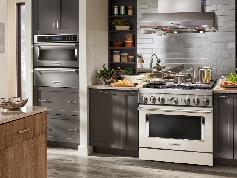 View of wall oven, stove and hood