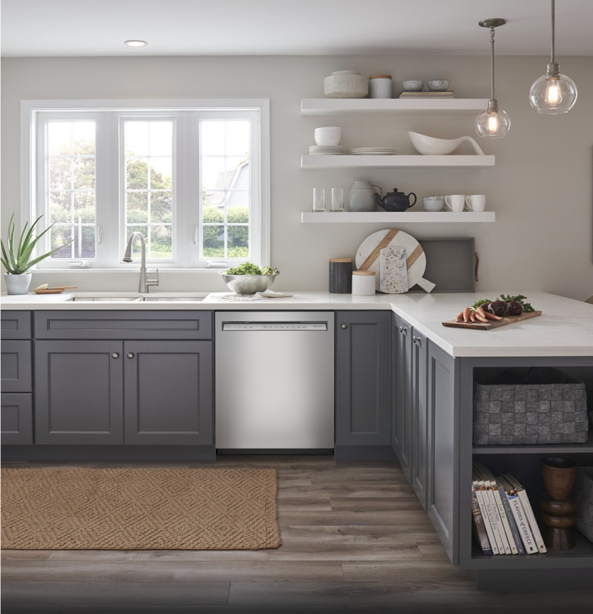 A bright, light kitchen with stainless steel appliances