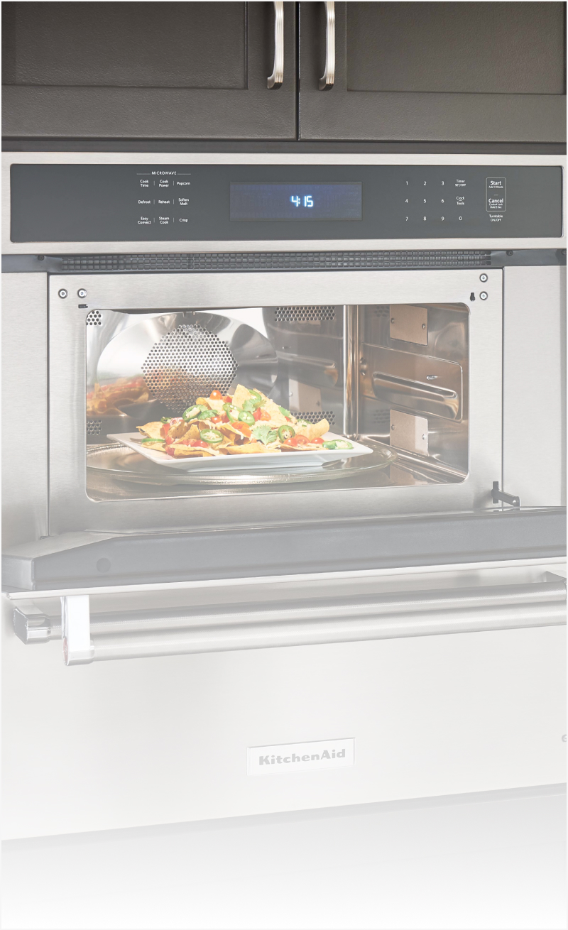 An open microwave with food inside