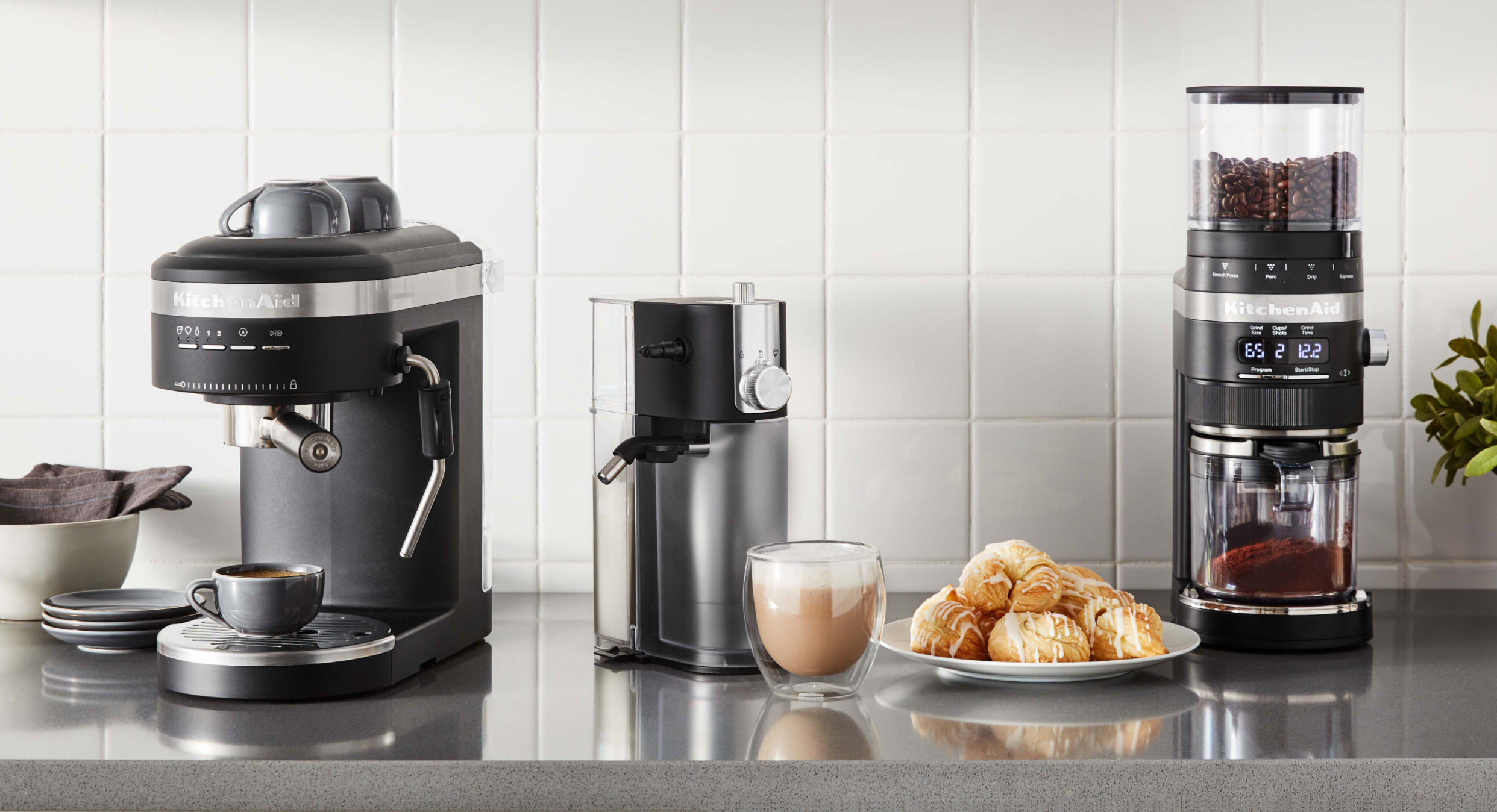Kitchen with white backsplash and KitchenAid® Coffee Collection 