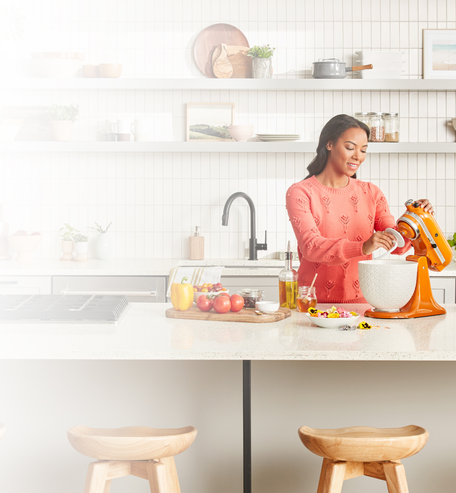 Woman with KitchenAid® Artisan® Series Stand Mixer and fresh vegetabes