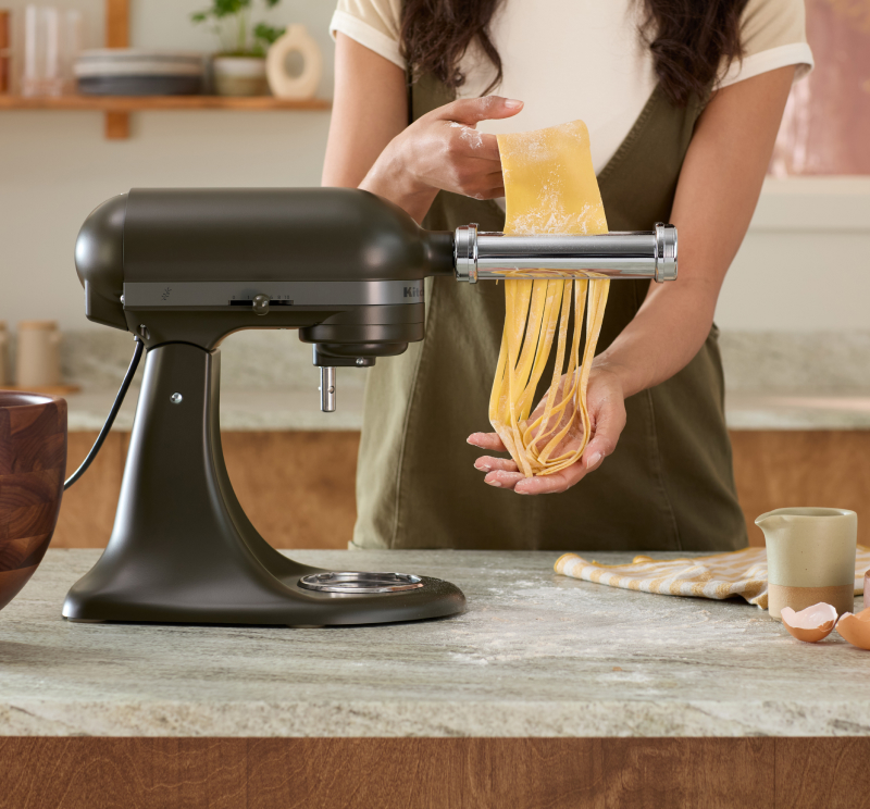 A pasta roller attachment on the 2024 Design Series Stand Mixer, Evergreen.