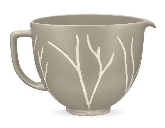 A bare leaves patterned ceramic bowl for a stand mixer.
