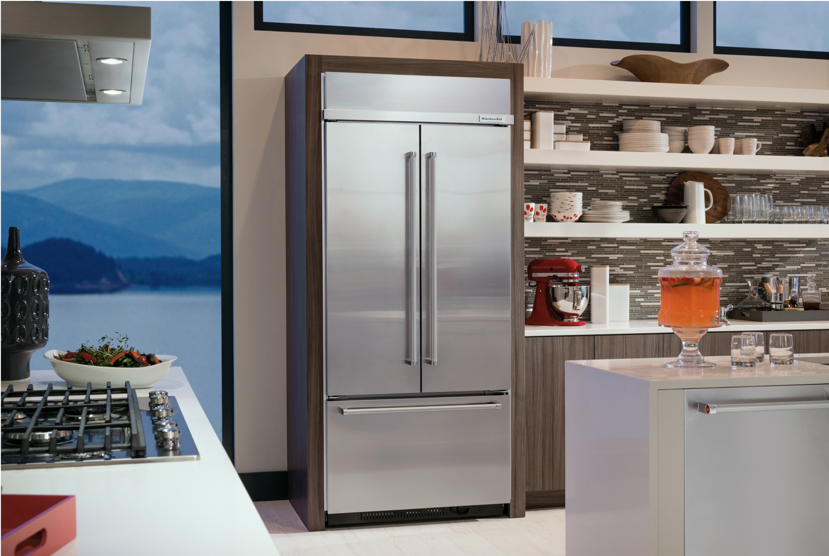 A KitchenAid® built-in refrigerator installed in a modern kitchen.