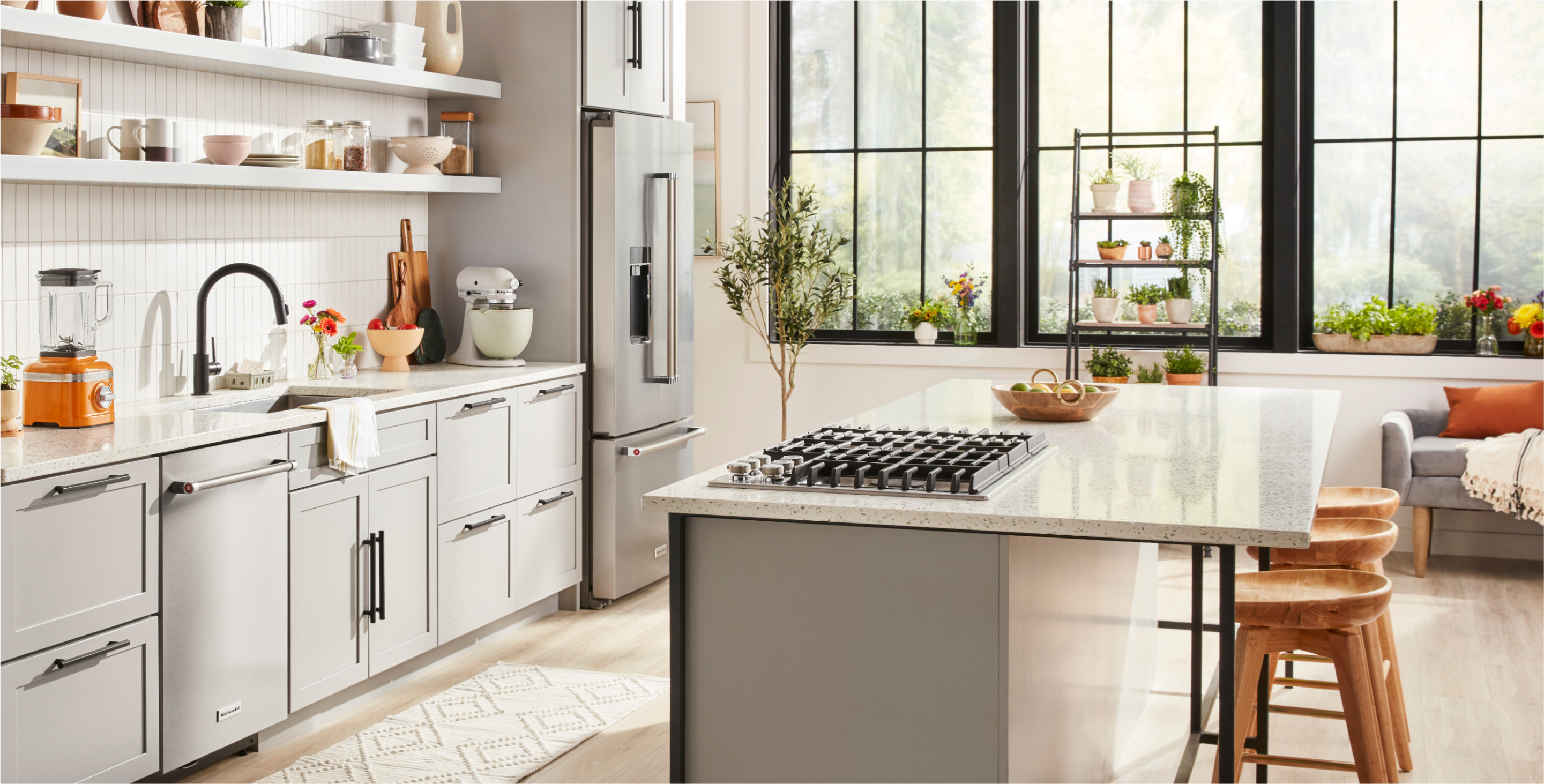 A modern kitchen with stainless steel KitchenAid appliances.