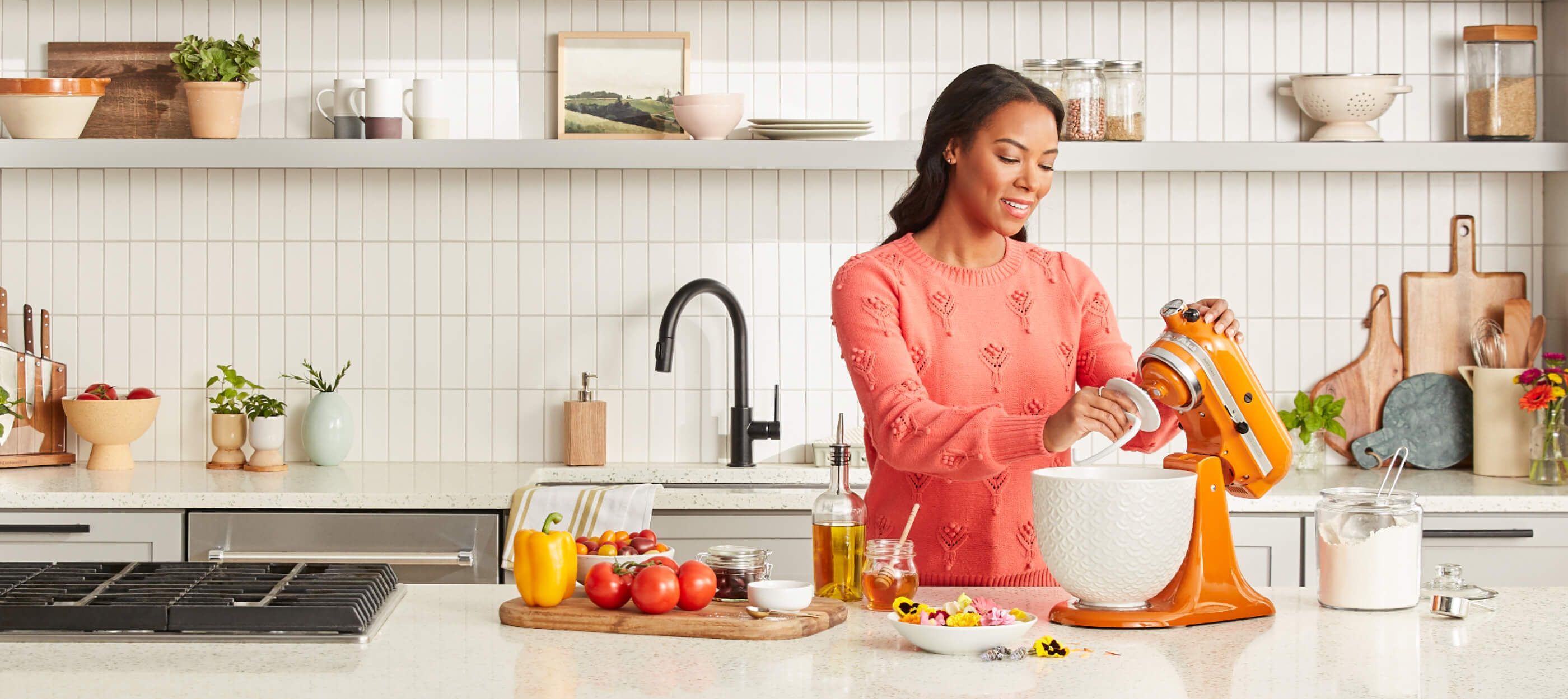 A person attaching a dough hook on a Honey Stand Mixer.