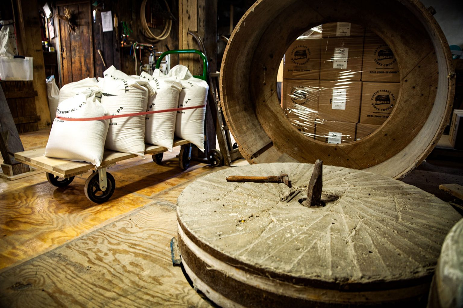 The inside of the grain farm featuring the old stone grain mill.