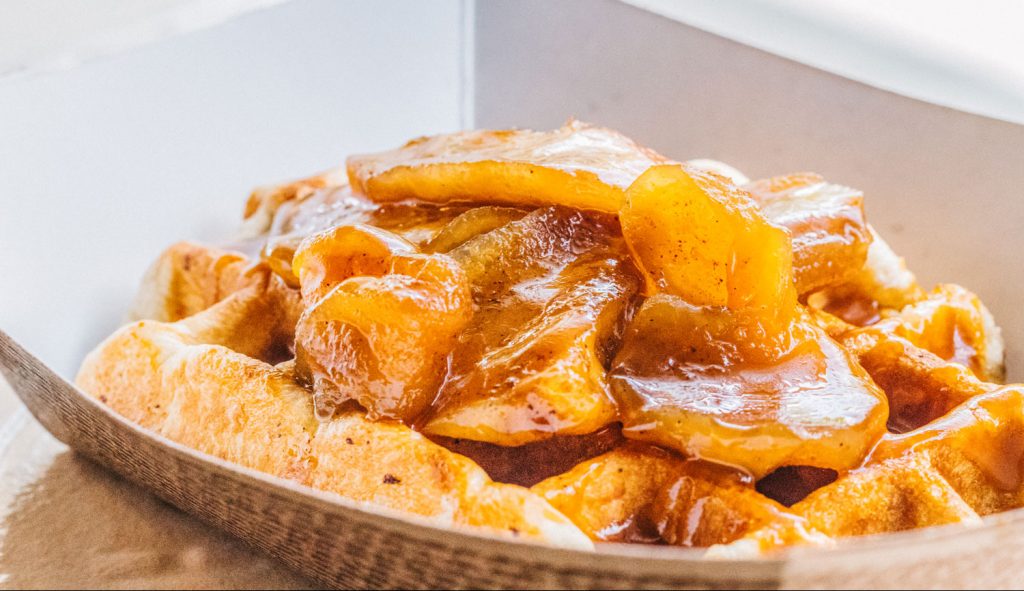 A waffle topped with caramelized fruit filling from Nina's Ice Cream.