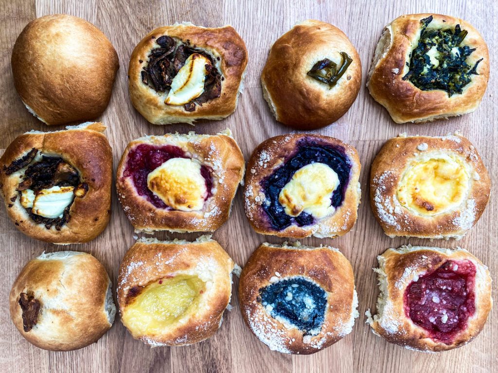 Kolaches resting on a cutting board.
