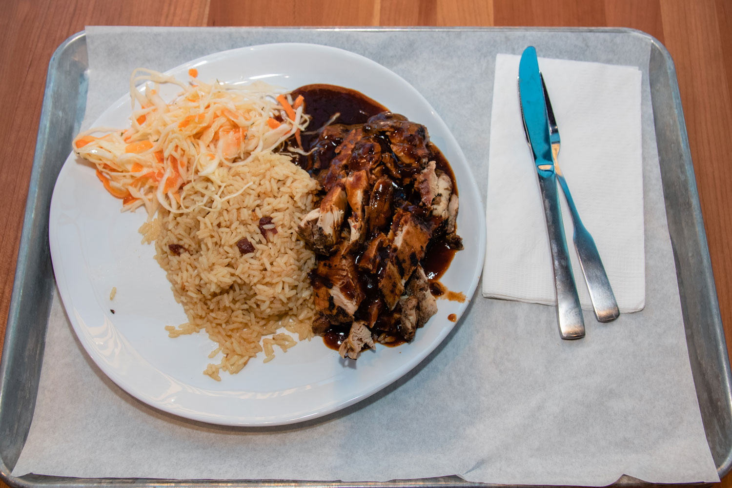 A large plate of Jamaican food.