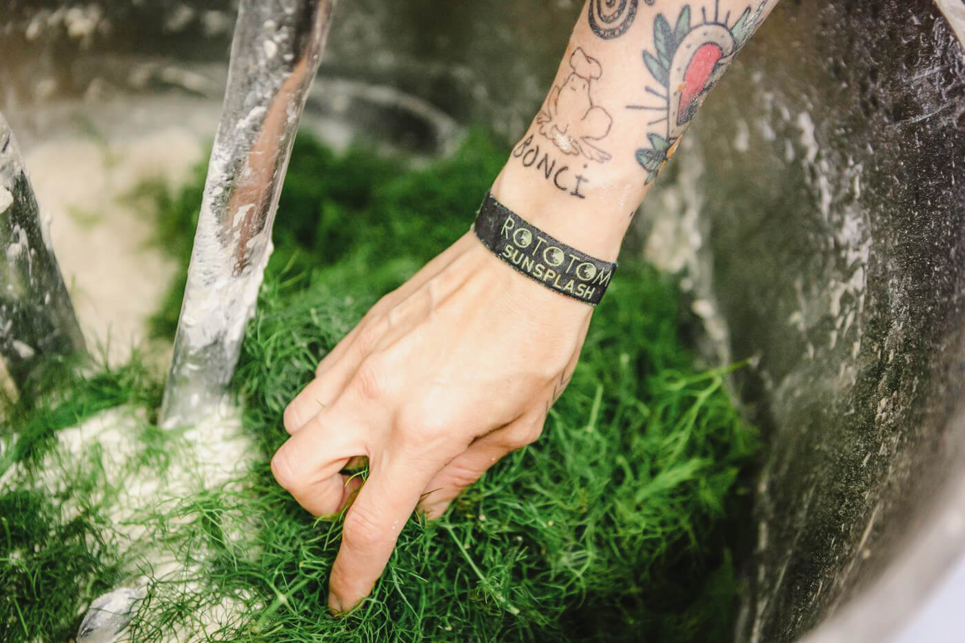 A large mixing bowl holding ingredients ready to incorporated into dough.