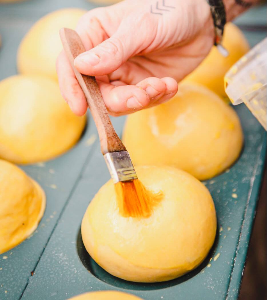 A brush used to butter the tops of bread.