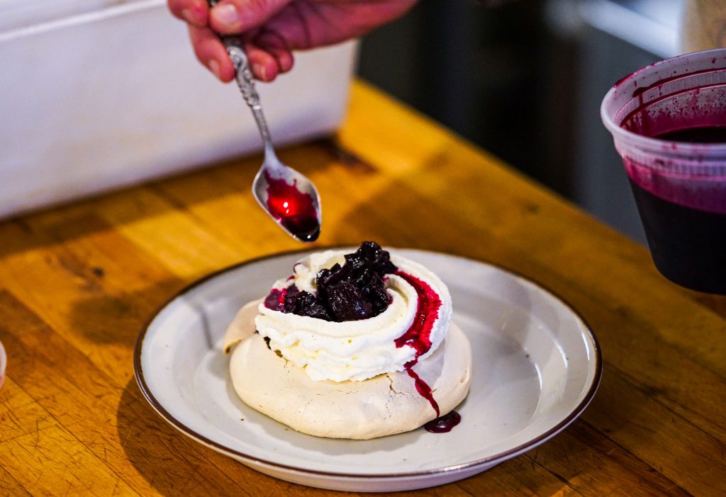 A pastry topped with beetroot sauce.