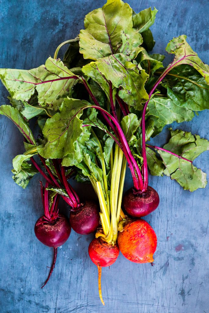 Clean beetroots resting on a table.