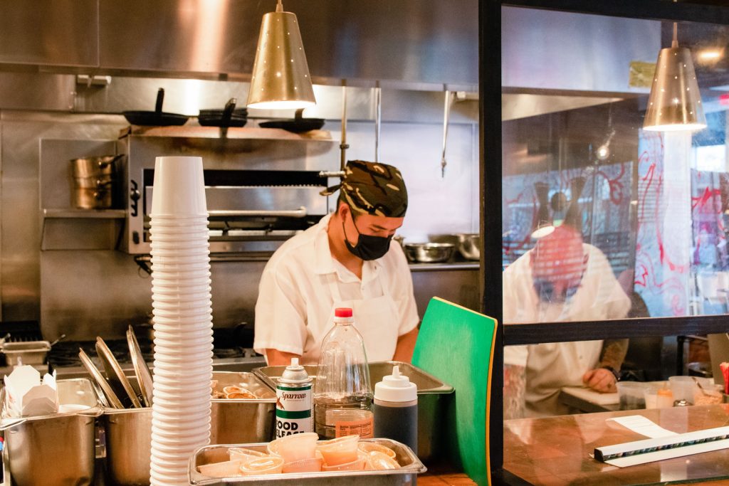 Chefs dilligently working in the restaurant kitchen of Myers + Chang.