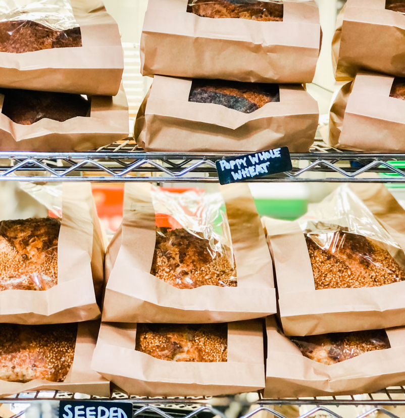 Paper-bagged breads on display.