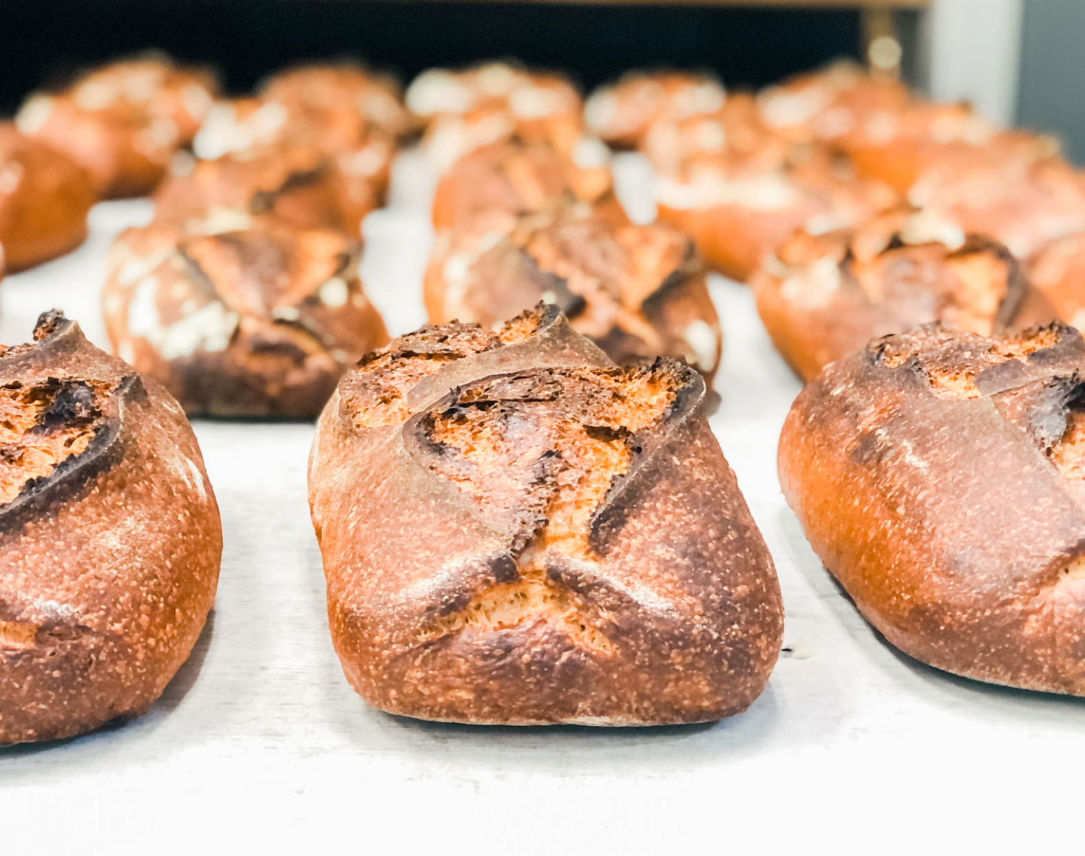 Freshly baked bread pulled from the oven.