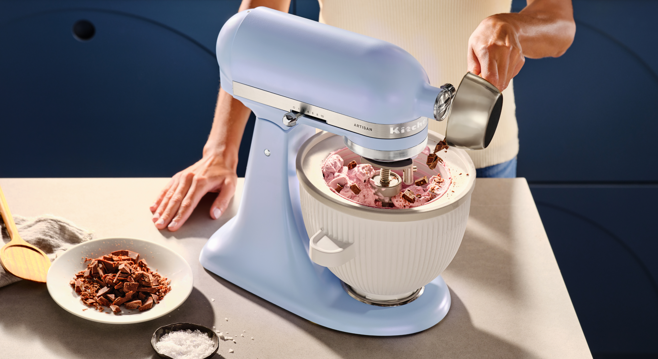 The periwinkle Blue Salt mixer being used to make ice cream.