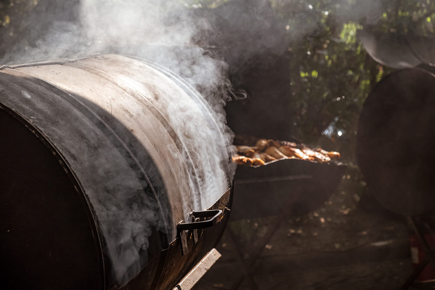 A cast iron grill smoking through its cracks.