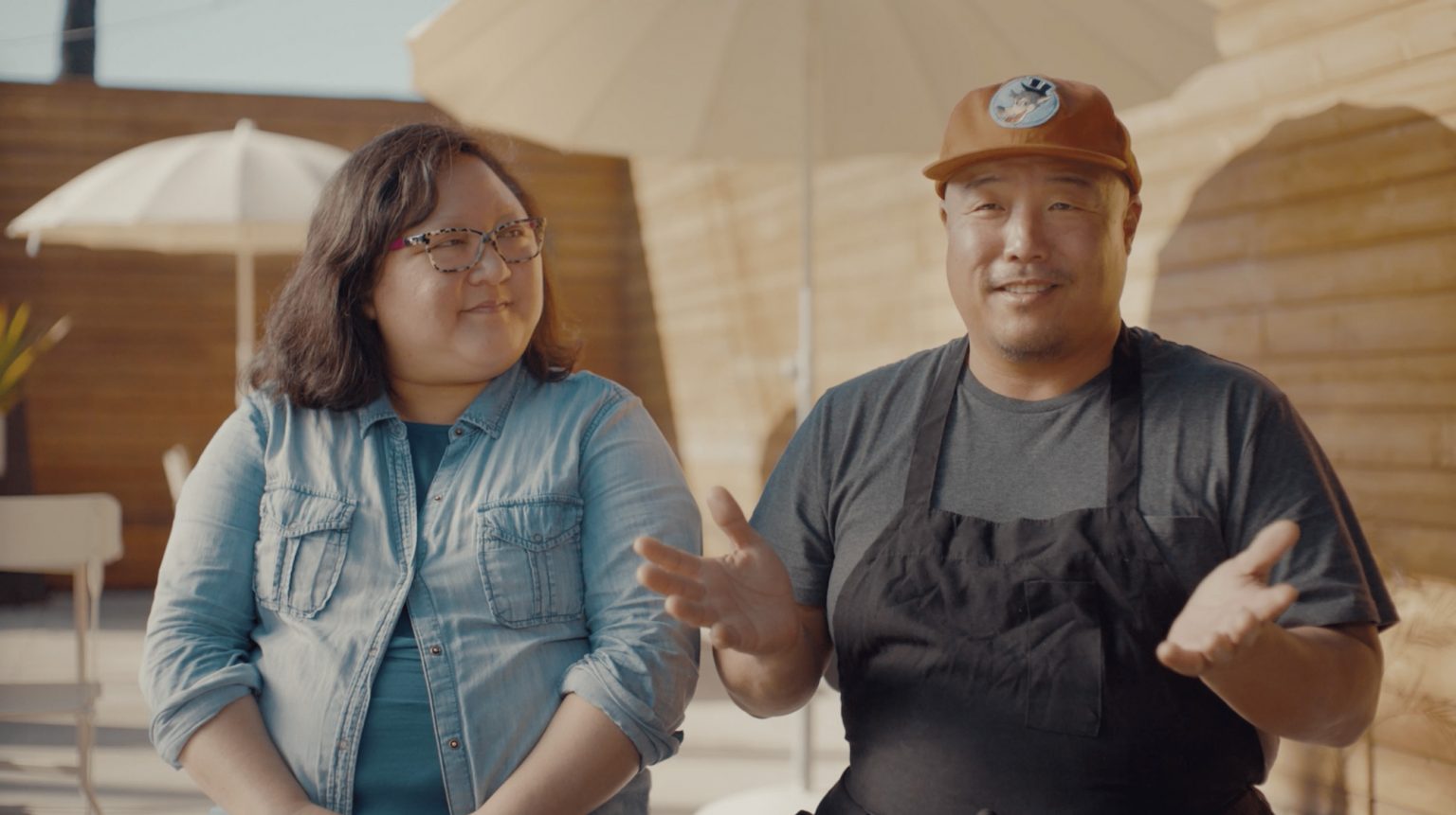 A candid photo of Richard Chang and Janelle Hu.