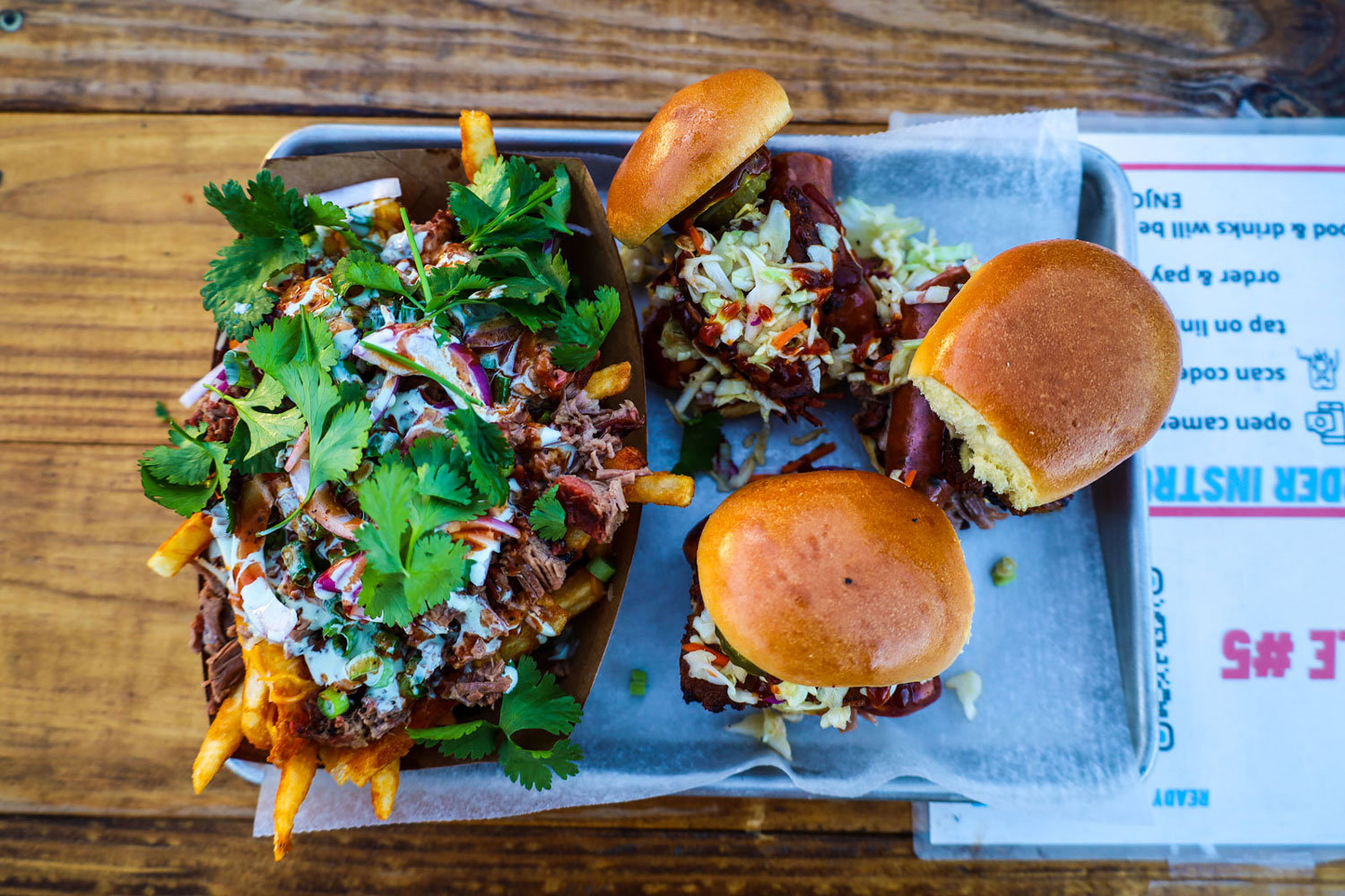 Loaded french fries and sandwiches.