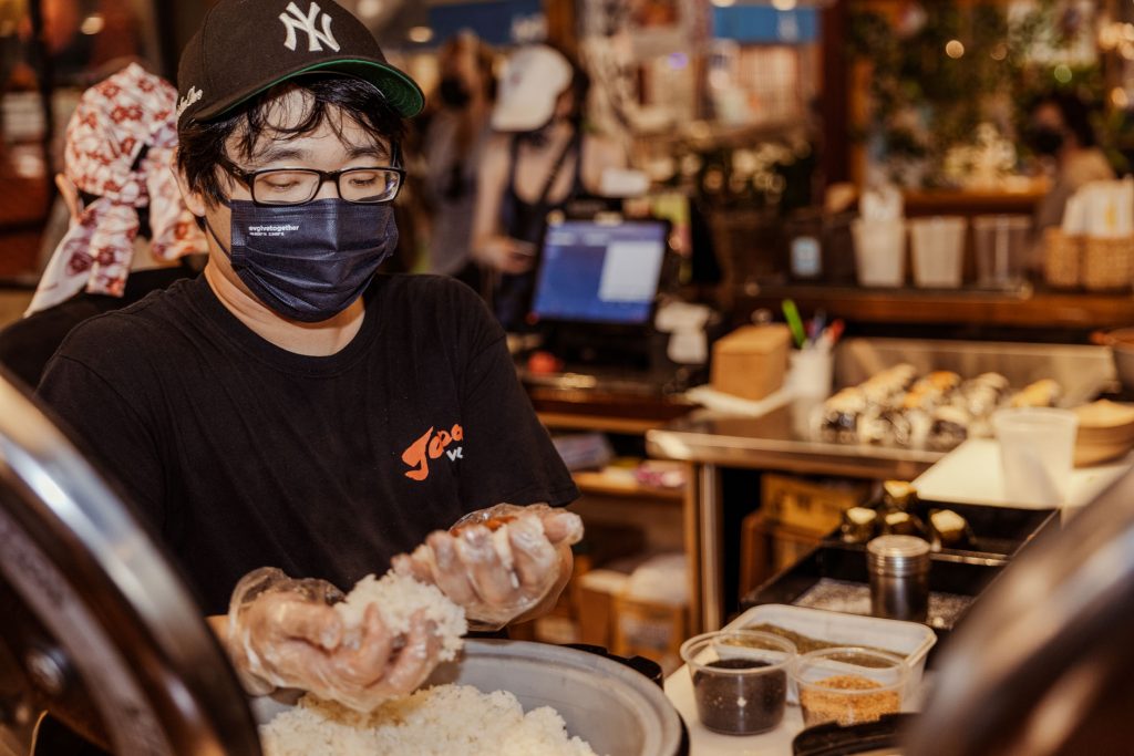 A person making rice balls.