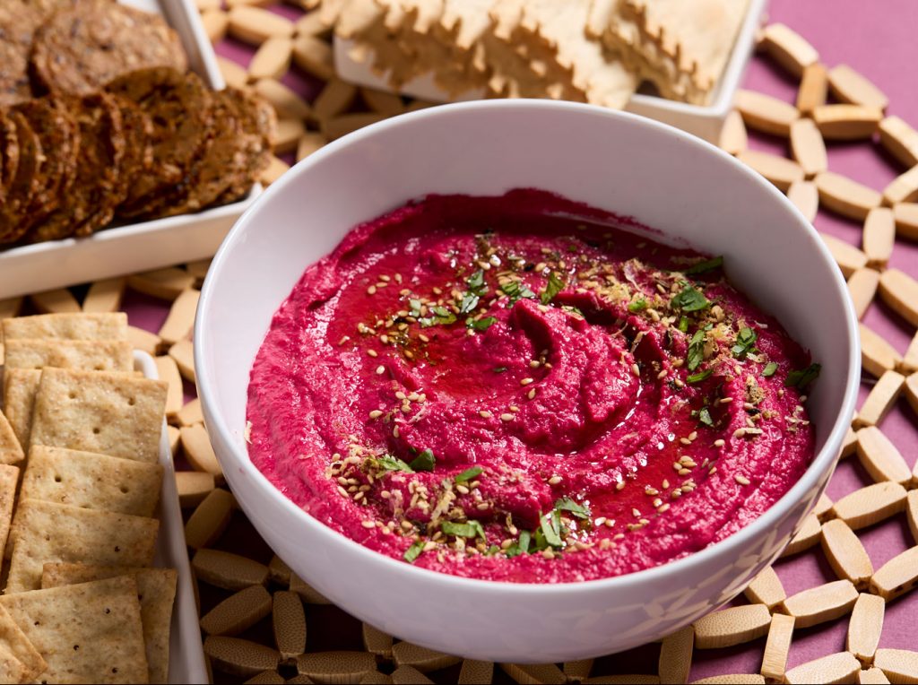 A bowl of beetroot hummus.