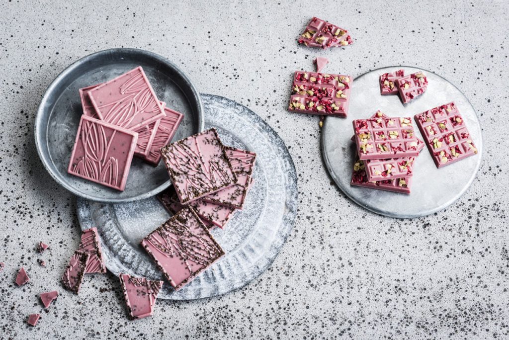 Plates of ruby chocolate squares.