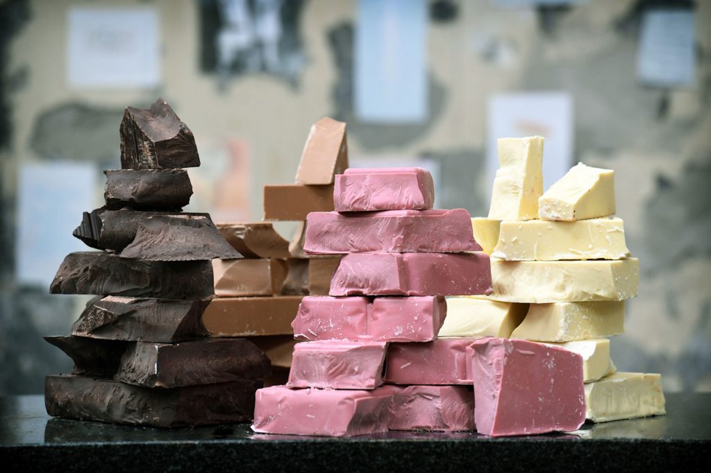 Chunks of the four chocolates: dark, milk, white and ruby.