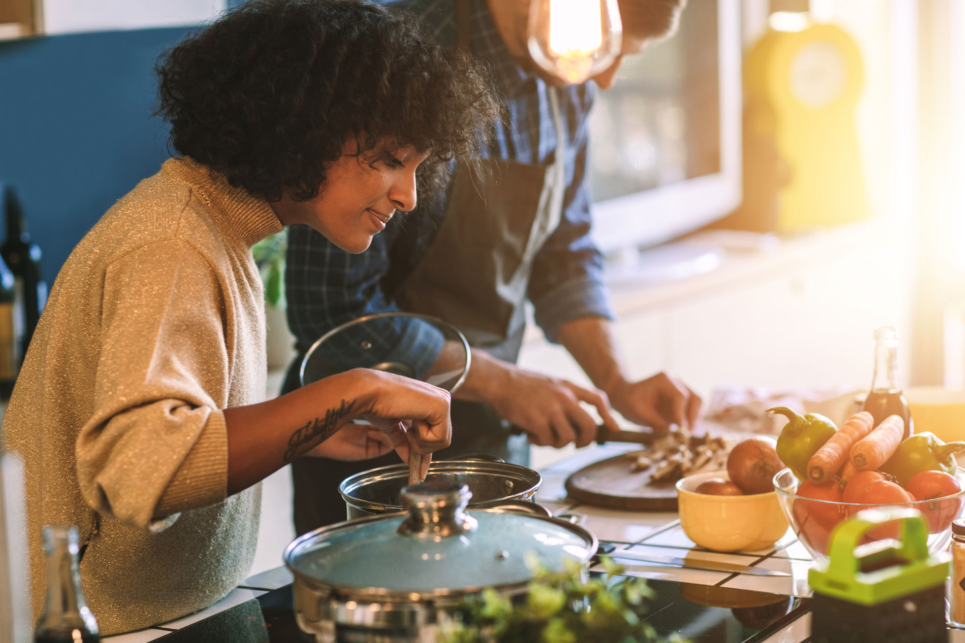 Two people making food.