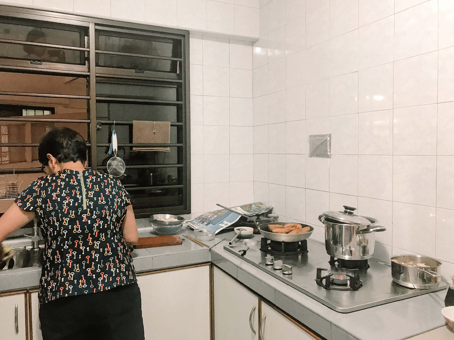 A mom working diligently in her kitchen.