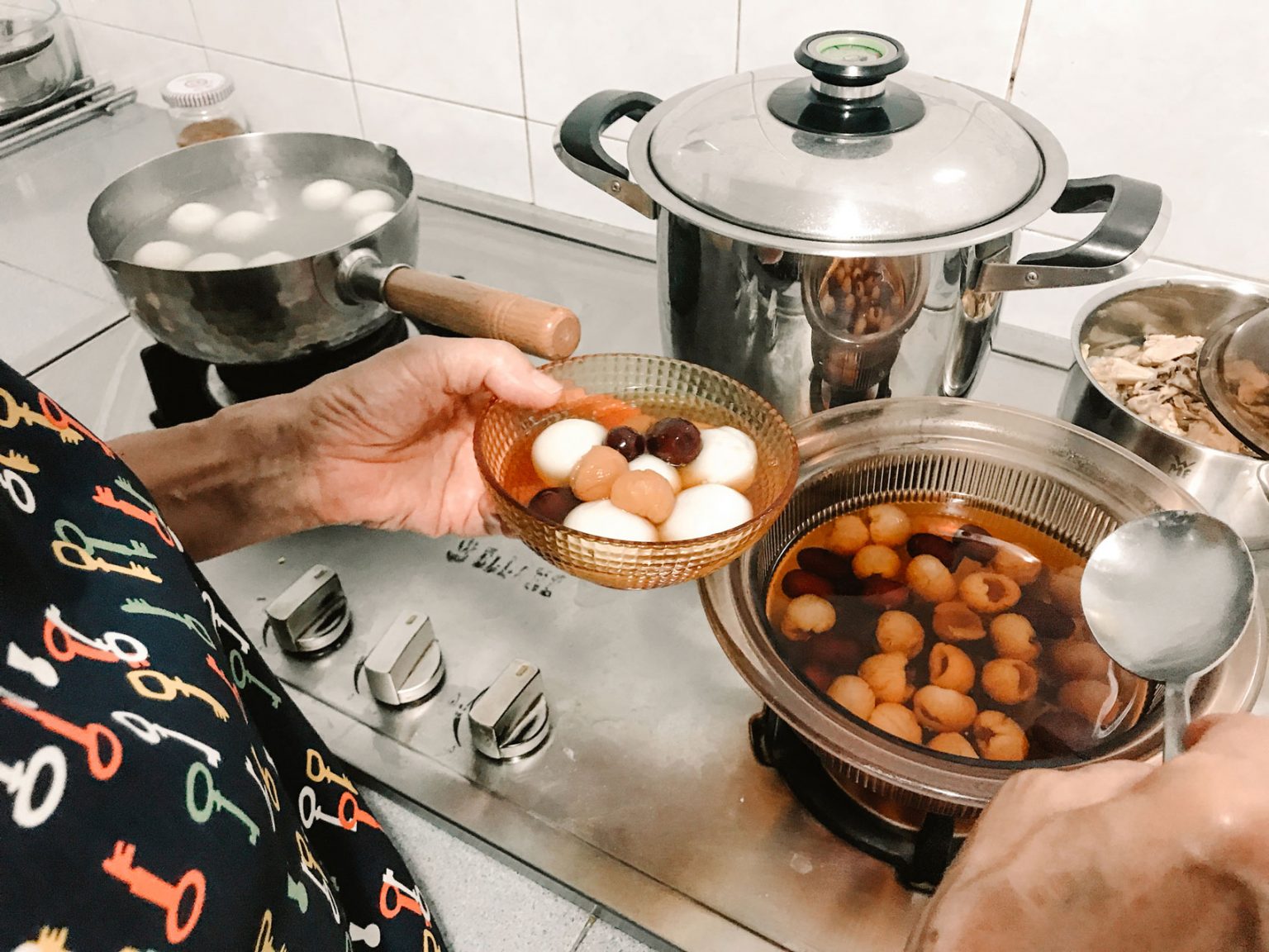 A mom serving food from a pot into a bowl.