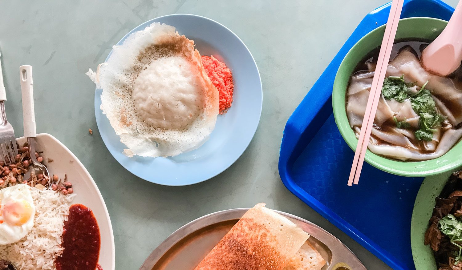 A table filled with a variety of Asian dishes.