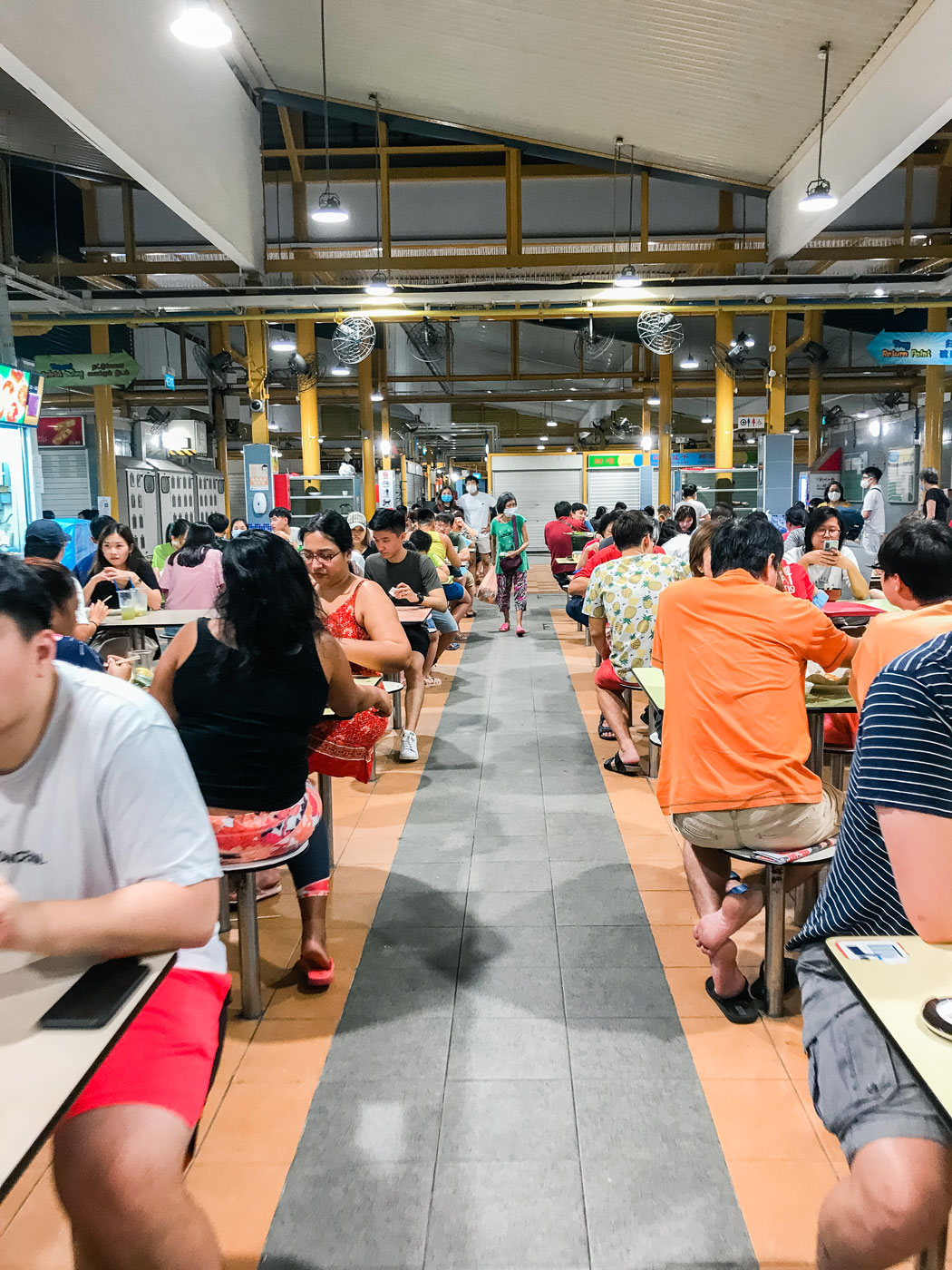 A community of people sitting down to eat.