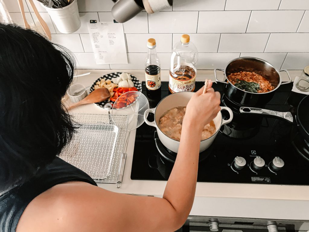 Melly Fong frying small pieces of pork.
