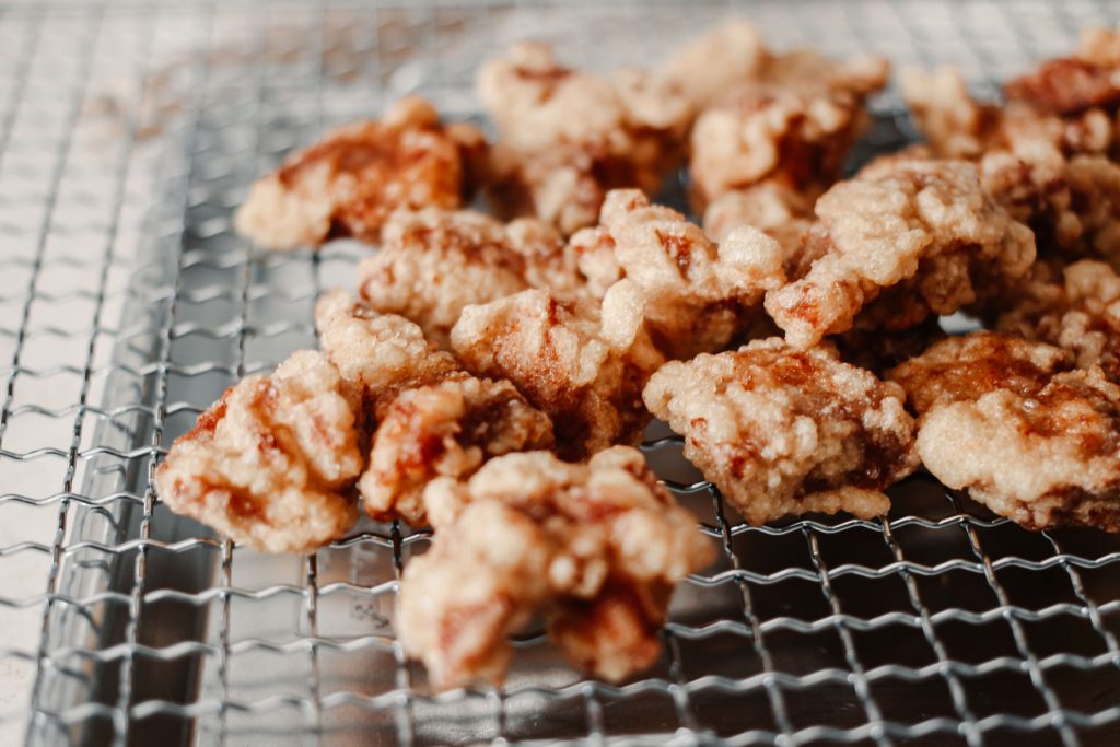 Small pieces of fried pork out to cool.