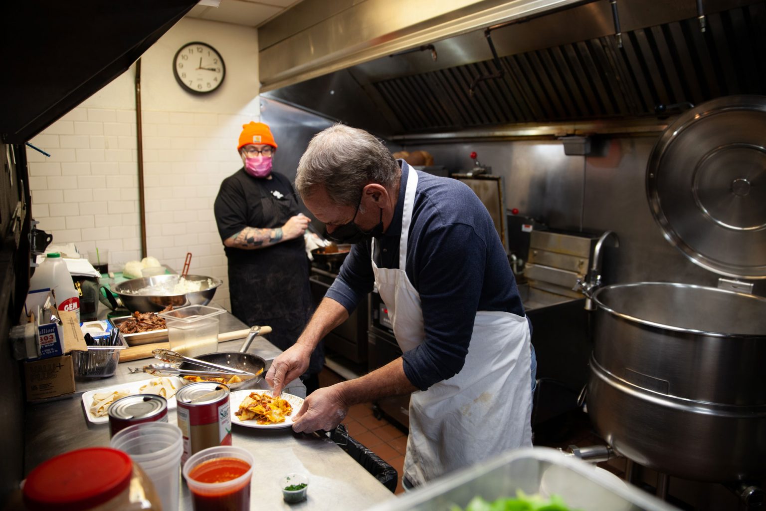 Andrew Abruzzese and Matthew Levin working in the kitchen of Pineville Tavern.