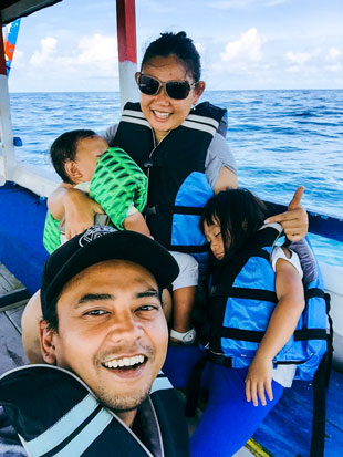 Shahrom's family posing for a photo.