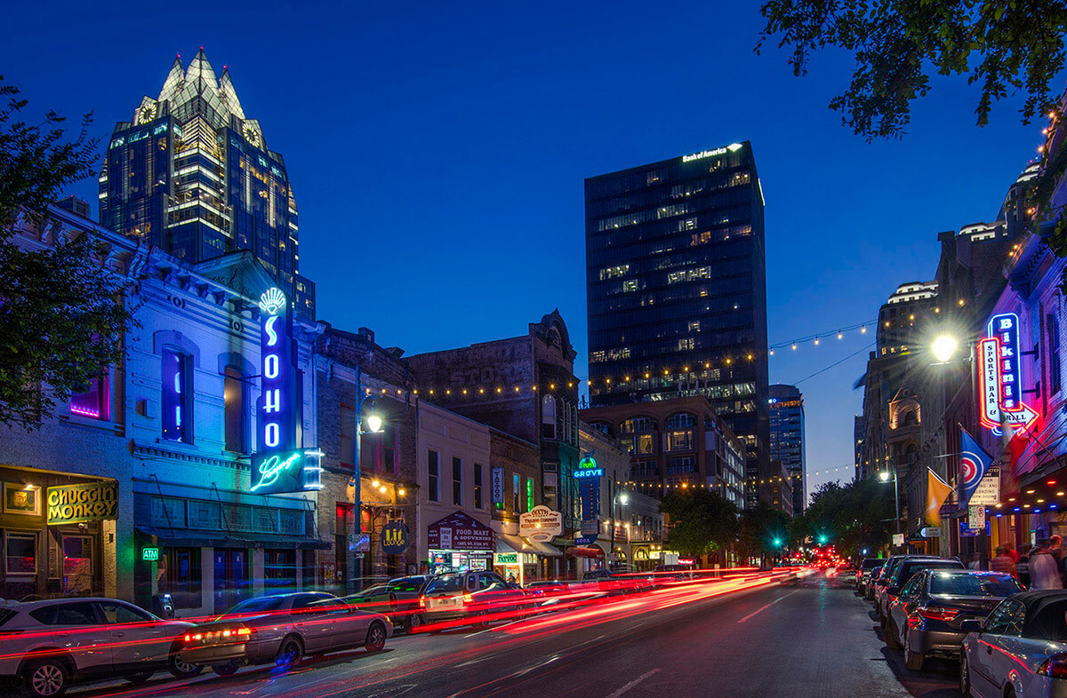 A lively cityscape of the city of Austin, Texas at night.