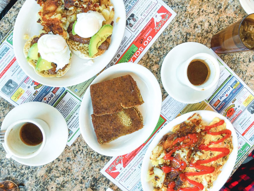 A white plate filled with Scrapple, a savory loaf made with pork scraps.