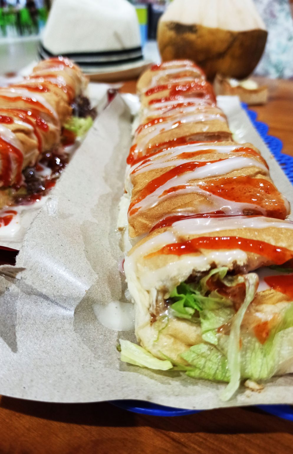 Two chicken roti johns ready to be eaten.