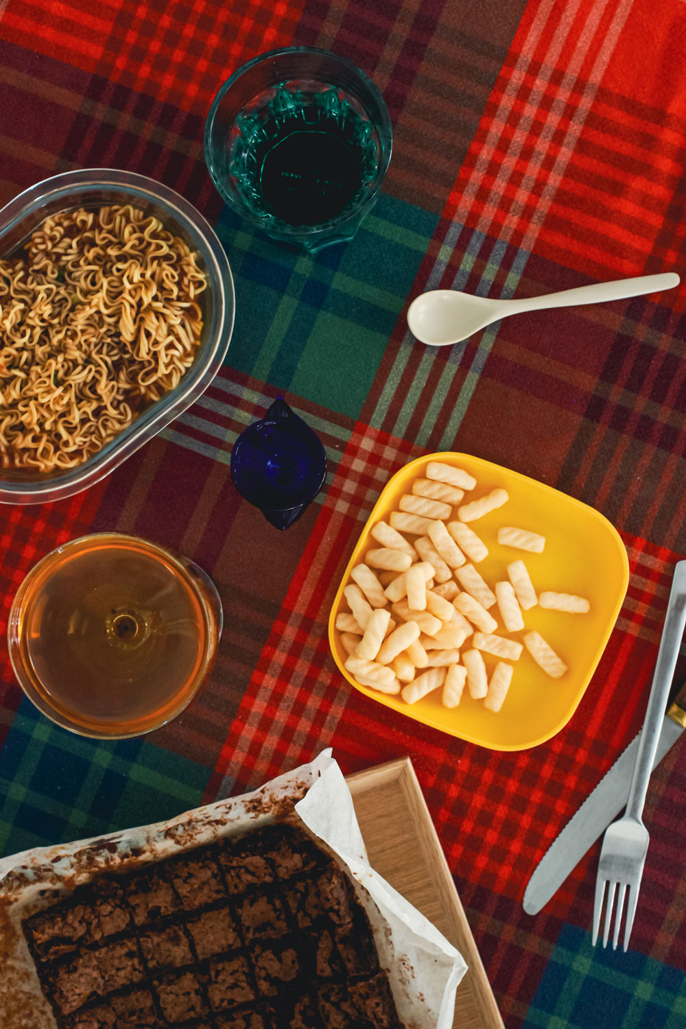 A dining table with food set out for one.
