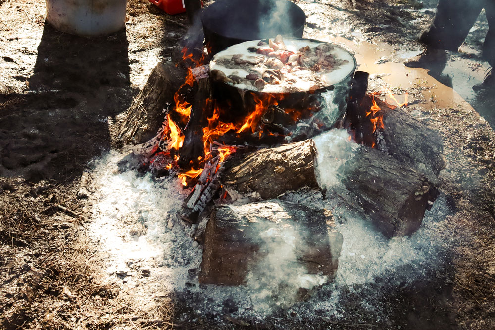 Lowcountry boil of tantalizing mix of shrimp, crab, potatoes, and sausage also known as Frogmore Stew on an open fire.