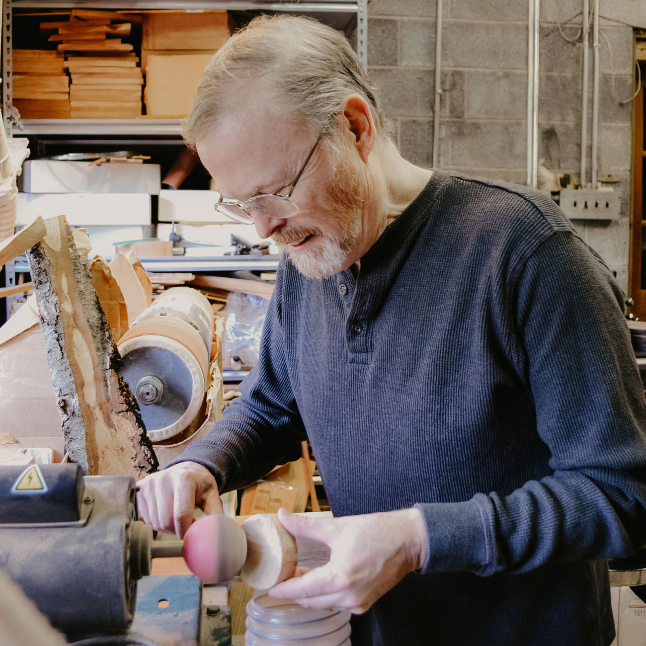 Jonathan Simons working with his tools.