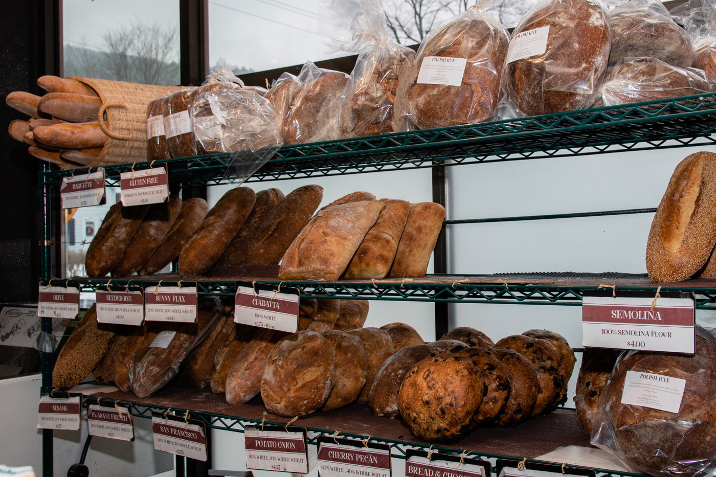 A variety of loaves of bread on display.