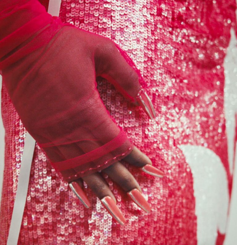 A close up of the gloves and skirt of Look Twelve.